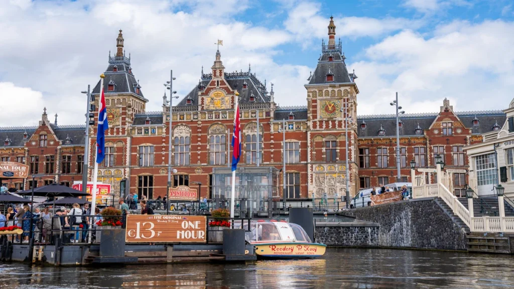 Amsterdam Central Station boat cruise People boarding the boat from the central station.