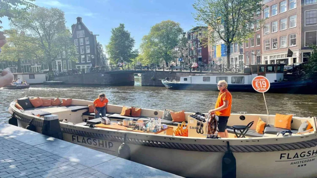 Amsterdam Open Boat Canal Cruise An open boat cruised docked, waiting for the passengers to board.